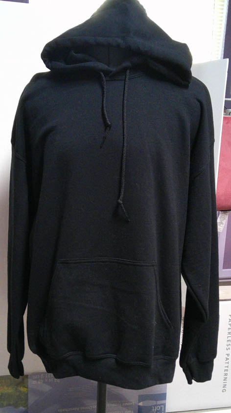 Black hooded one of a kind sweatshirt with evil villain machine embroidered on back.  Size L