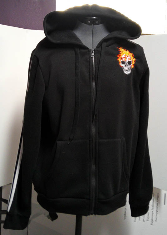 Black hooded one of a kind sweatshirt with machine embroidery skulls  Size L