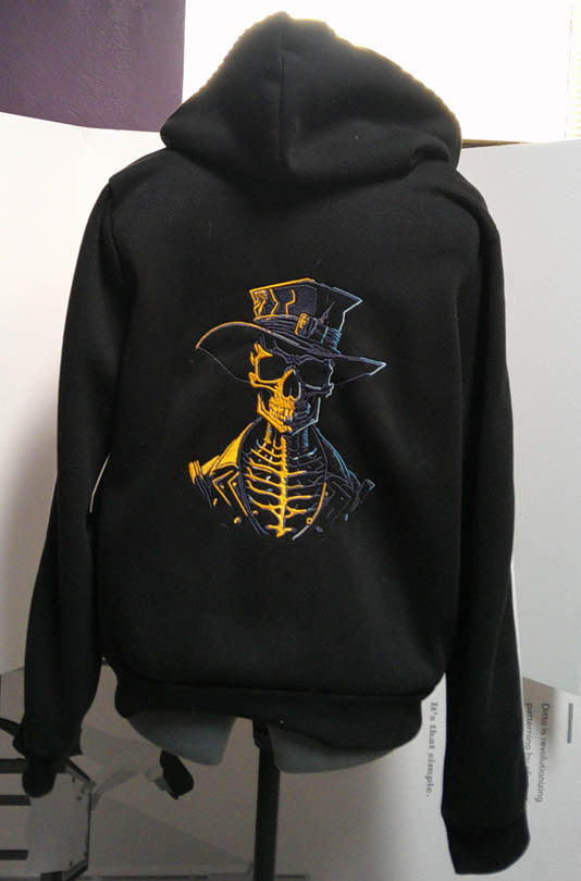 Black hooded one of a kind sweatshirt with machine embroidery skulls  Size L