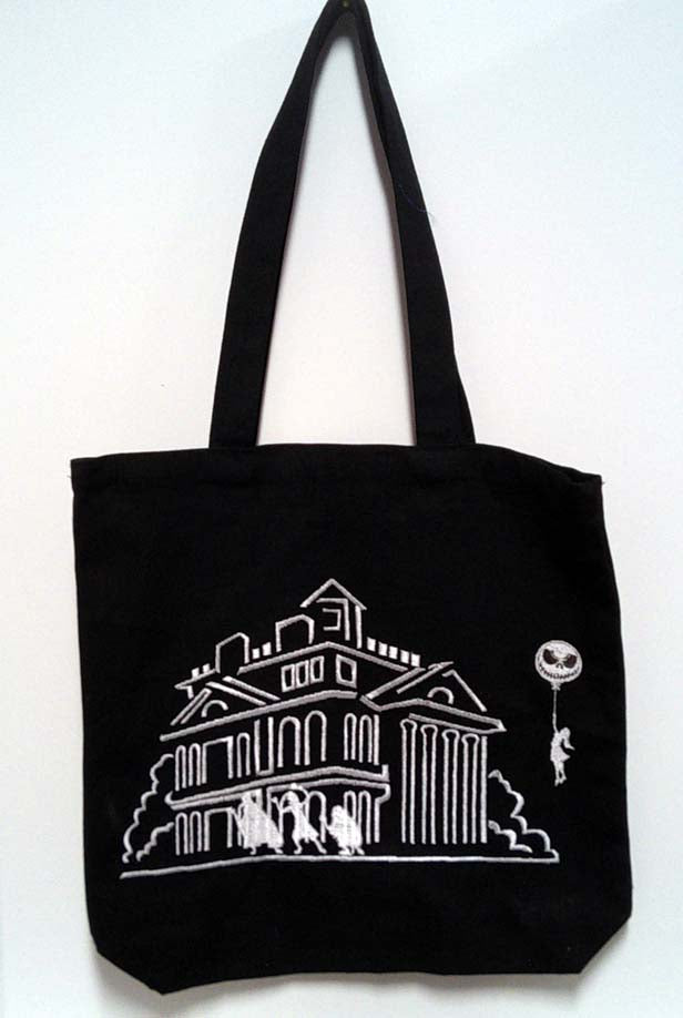 Black haunted house tote bag