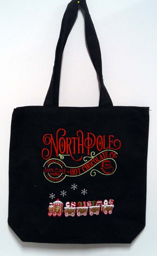 Black canvas tote with Christmas saying