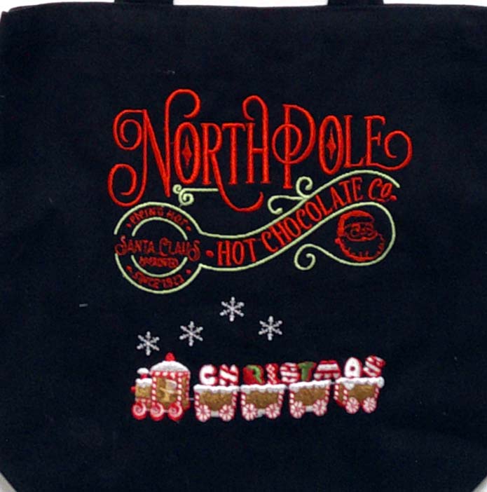Black canvas tote with Christmas saying