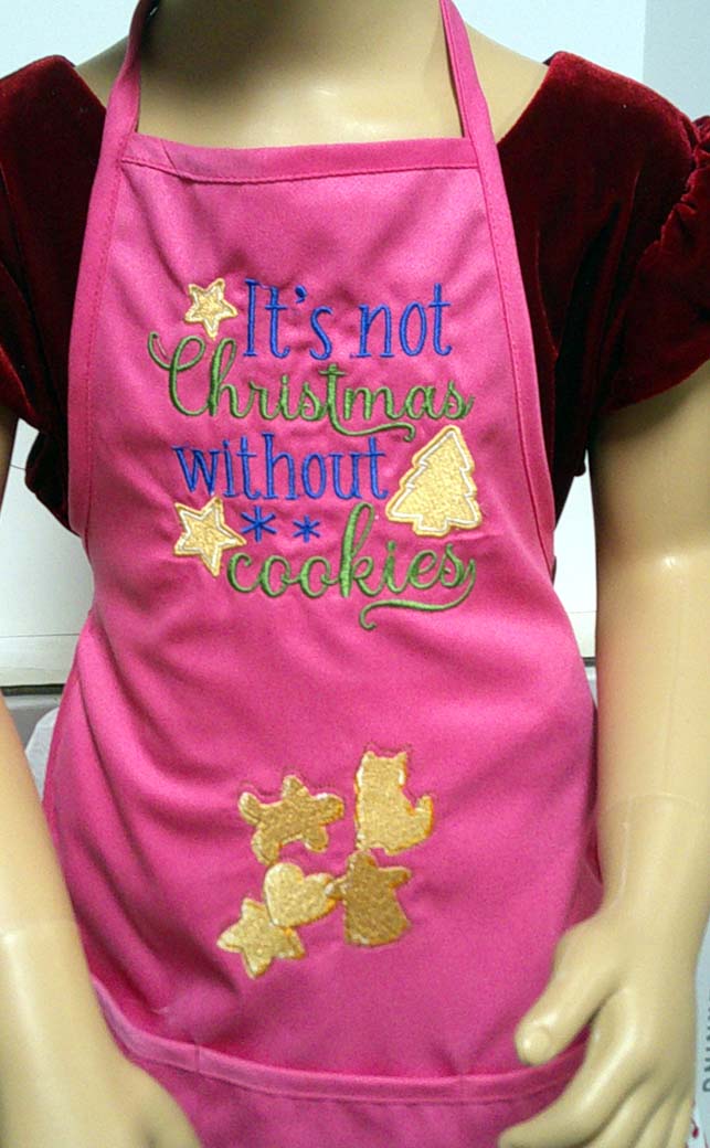 Hot Pink child's apron embroidered with Christmas cookies 6-7