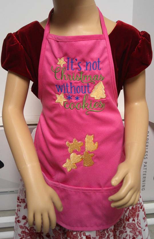 Hot Pink child's apron embroidered with Christmas cookies 6-7