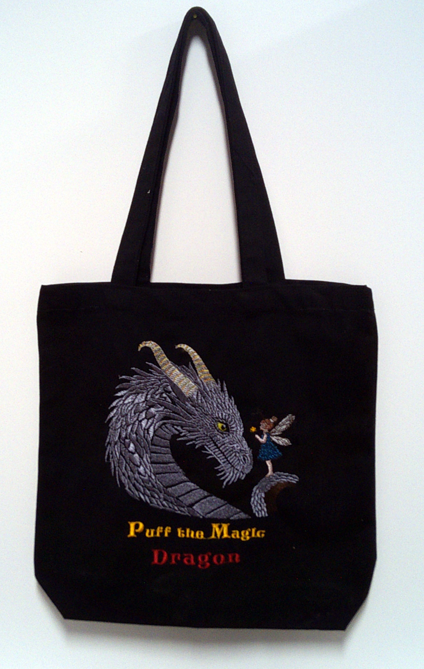 Black canvas tote with dragon and child