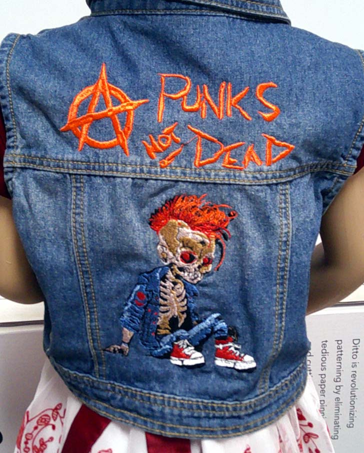 Child's denim sleeveless jacket with punk embroidered motif