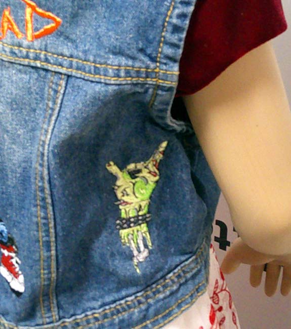 Child's denim sleeveless jacket with punk embroidered motif