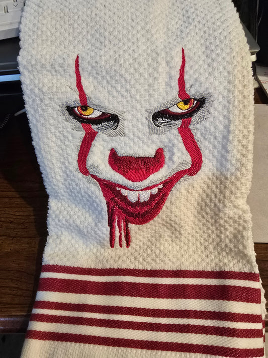 Scary clown potholder towel set.